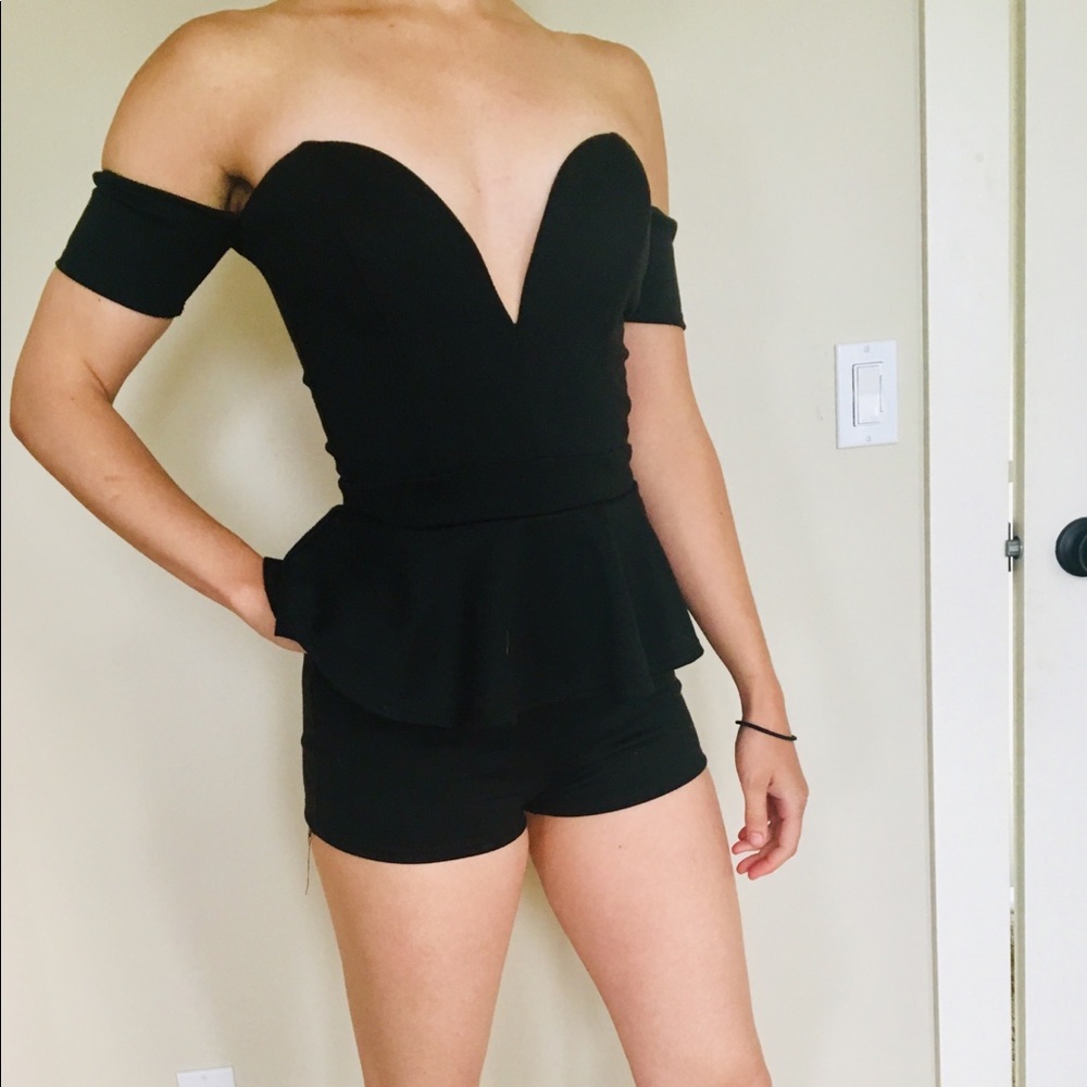 Black romper with a deep sweetheart neckline